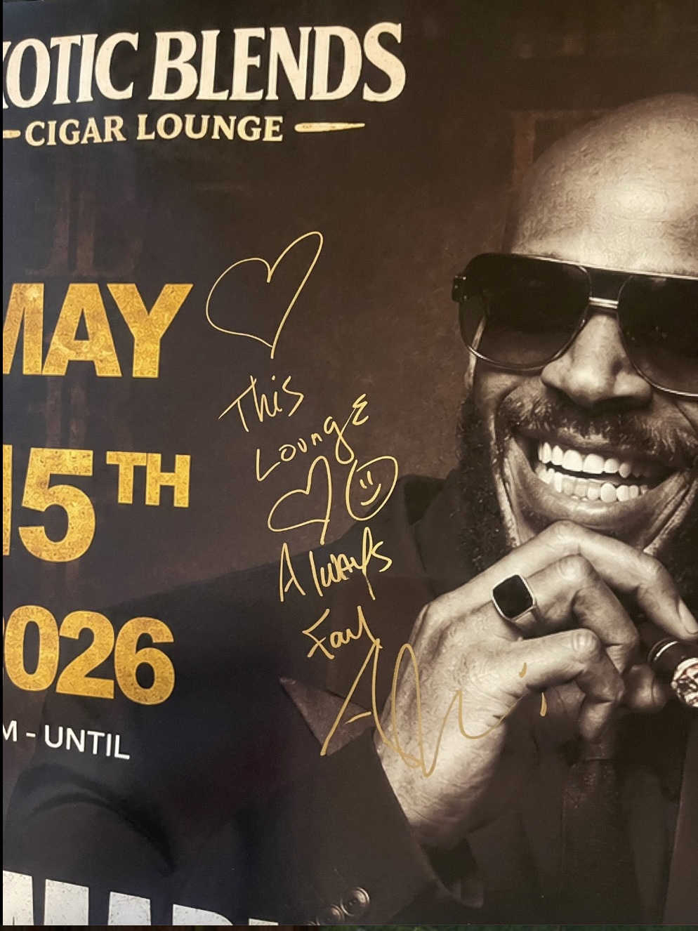 A signed Marlon Wayans event portrait reading This Lounge Always Family