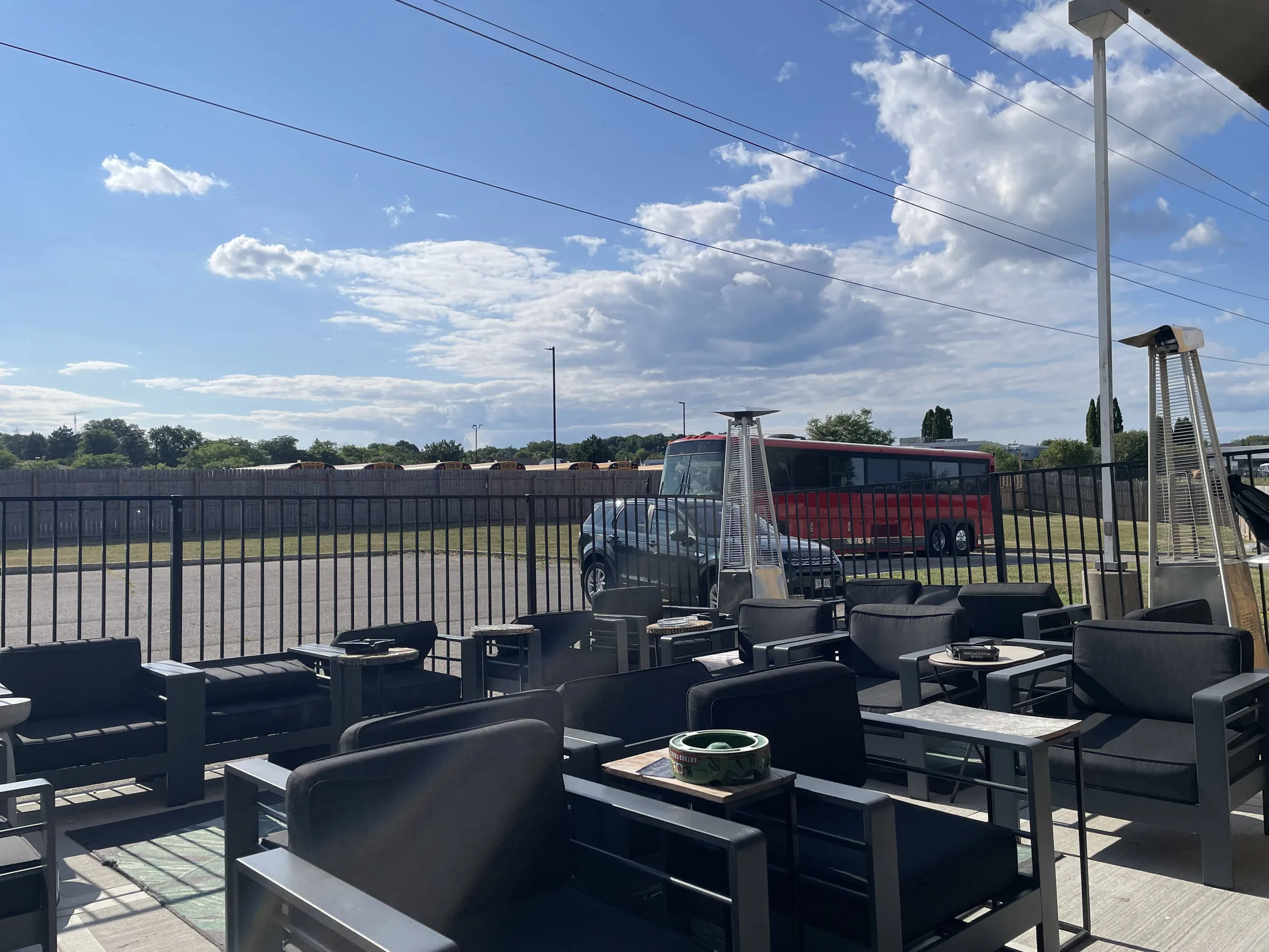 Outdoor patio seating beneath a blue Milwaukee sky